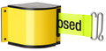 Retractable belt barrier with printed warning text mounted on warehouse upright