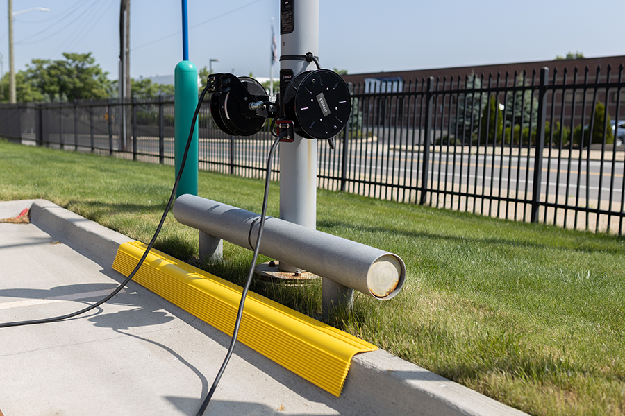 Yellow curb guard installed at facility entrance