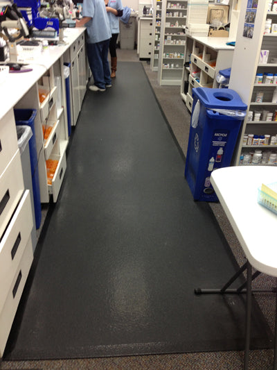 TuffSkin anti-fatigue mat at pharmacy counter