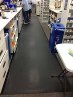 TuffSkin anti-fatigue mat at pharmacy counter